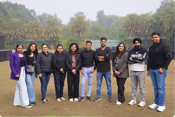 Team posing together at an outdoor retreat