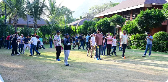 Teams taking part in an activity on a garden lawn