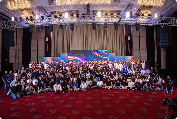 Large team gathered in an event hall